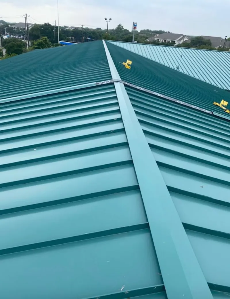 Green commercial metal roof ridge and valley for Metal Roof Repair in Pine Ridge